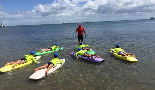 Kids learning water safety with instructors